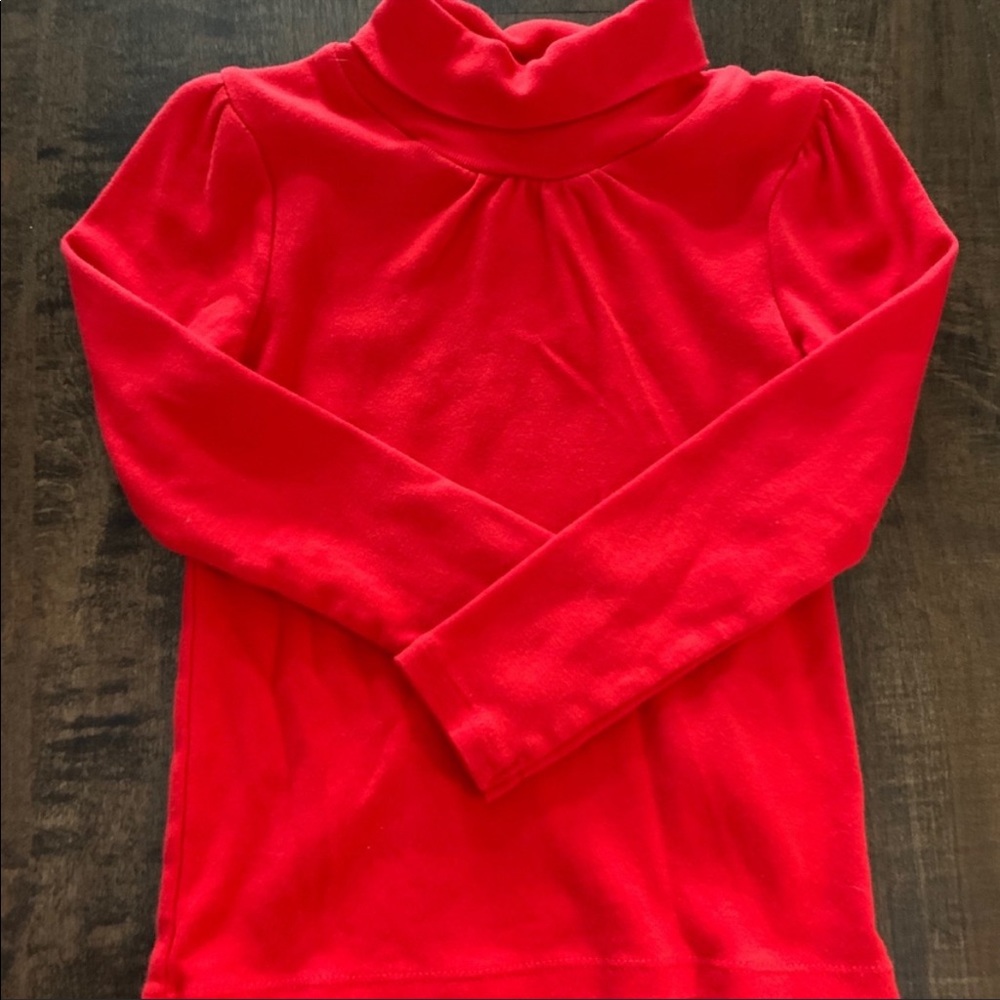 Carter’s red turtleneck